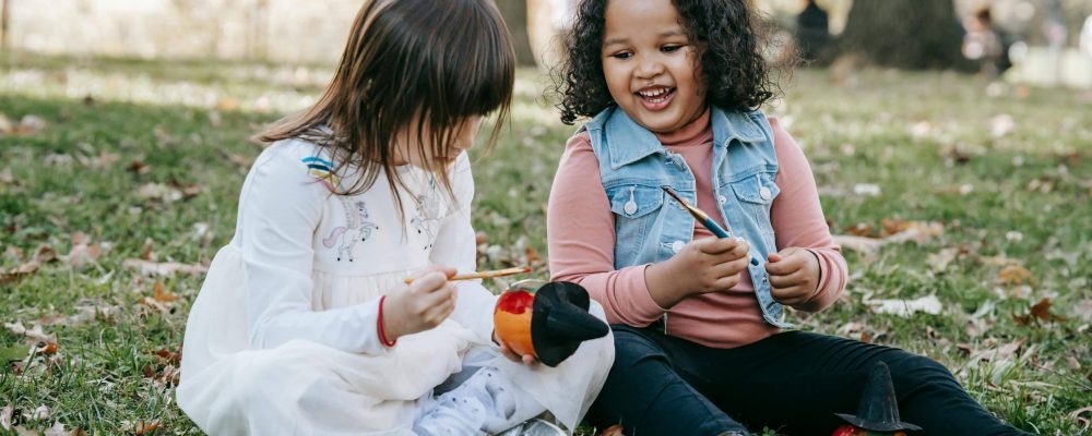 two girls doing Halloween activities